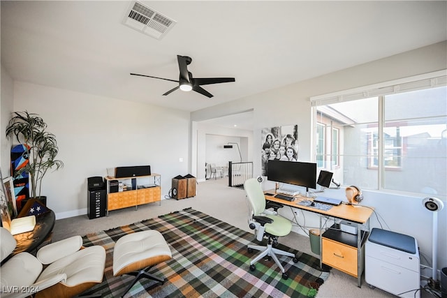 carpeted office with ceiling fan