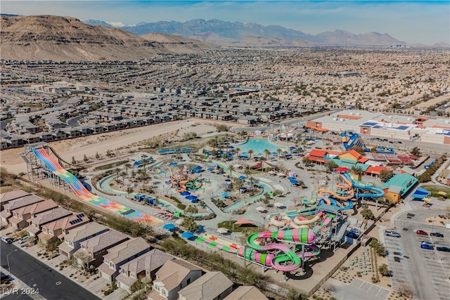 birds eye view of property with a mountain view