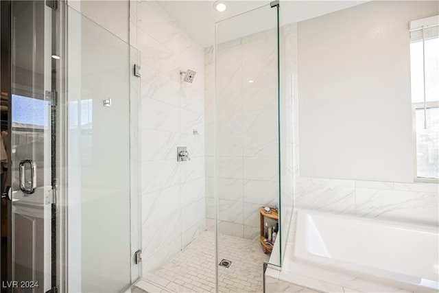 bathroom with separate shower and tub