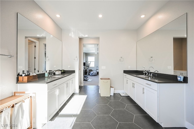 bathroom with tile patterned flooring and vanity