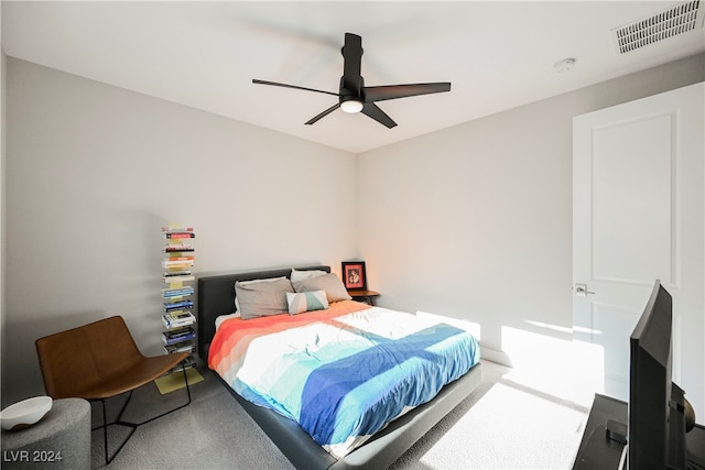 bedroom with ceiling fan and carpet floors