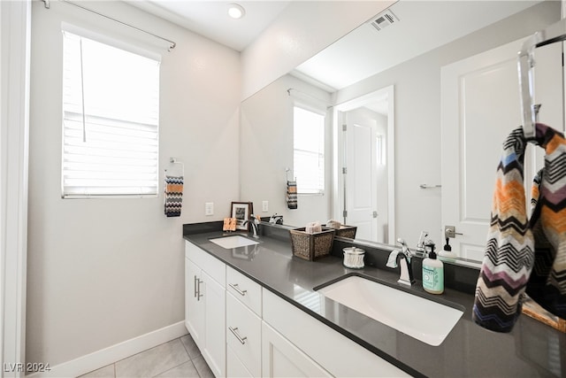 bathroom with vanity, tile patterned flooring, and plenty of natural light