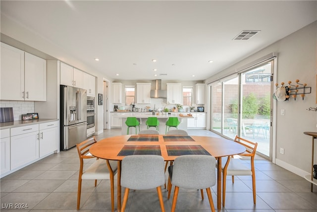 dining area with light tile patterned floors