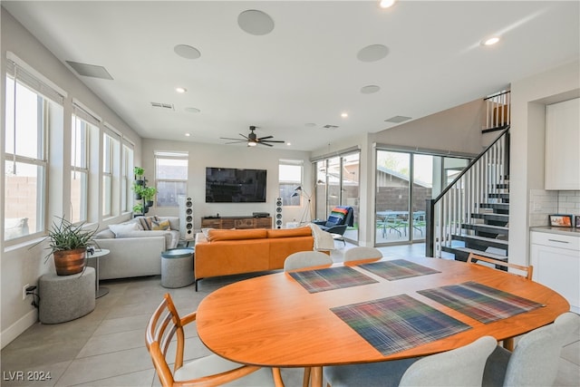 dining room featuring light tile patterned floors and ceiling fan