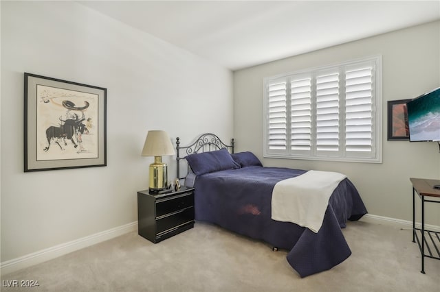 bedroom with light carpet