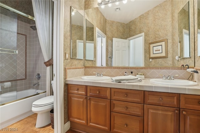 full bathroom featuring vanity, toilet, shower / tub combo, and tile patterned flooring