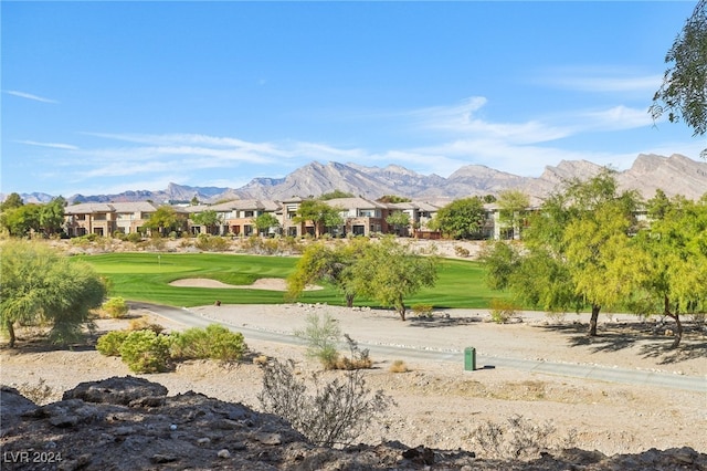 surrounding community featuring a yard and a mountain view