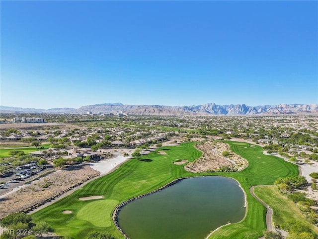 drone / aerial view with a water and mountain view