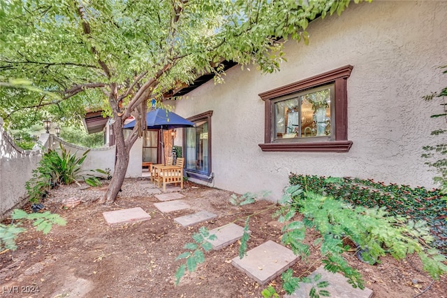 view of side of home with a patio