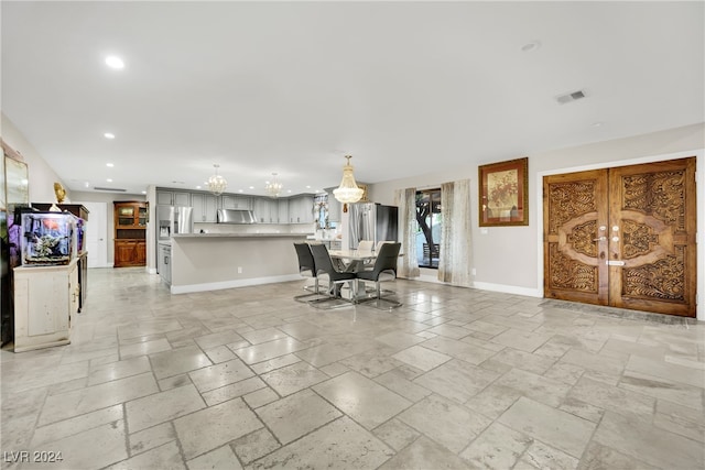 unfurnished dining area with an inviting chandelier