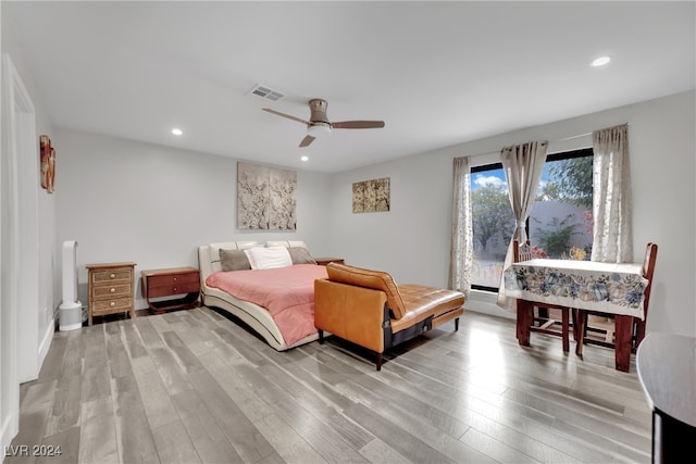 bedroom featuring ceiling fan and light hardwood / wood-style flooring