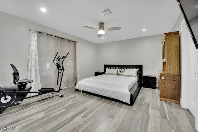 bedroom with light wood-type flooring and ceiling fan