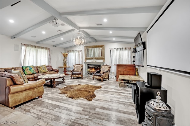 living room with light wood-type flooring, an inviting chandelier, and vaulted ceiling with beams