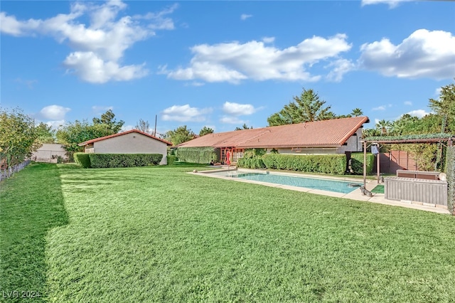 view of yard with a fenced in pool