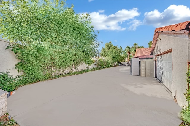 view of patio featuring a garage