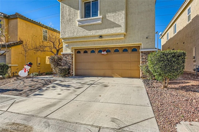 front of property with a garage