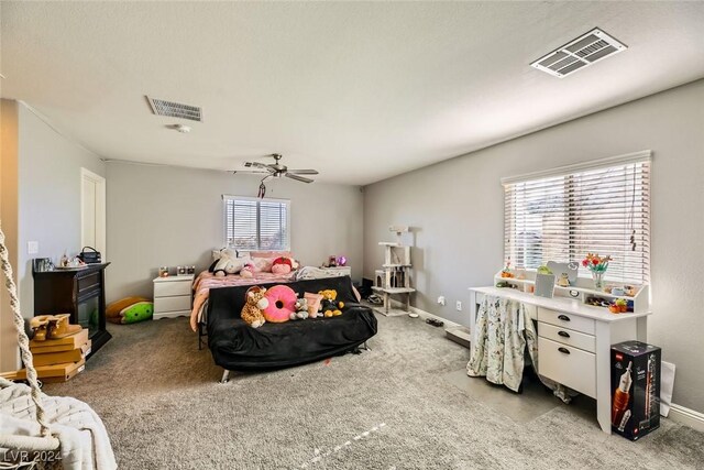 carpeted bedroom with ceiling fan