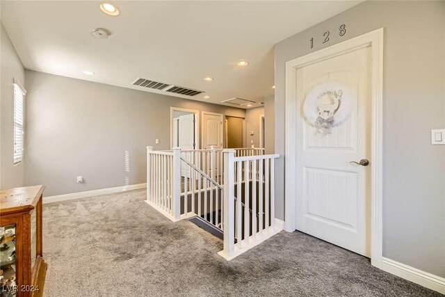 corridor featuring carpet flooring