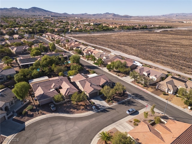 birds eye view of property with a mountain view