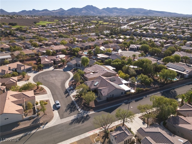 birds eye view of property featuring a mountain view