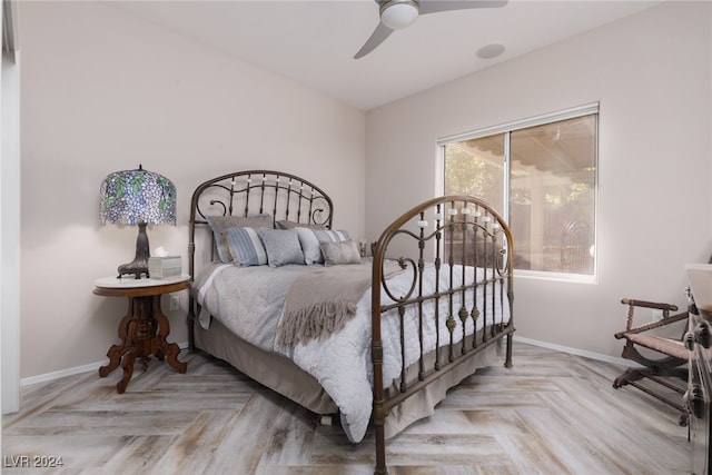 bedroom with light parquet floors and ceiling fan