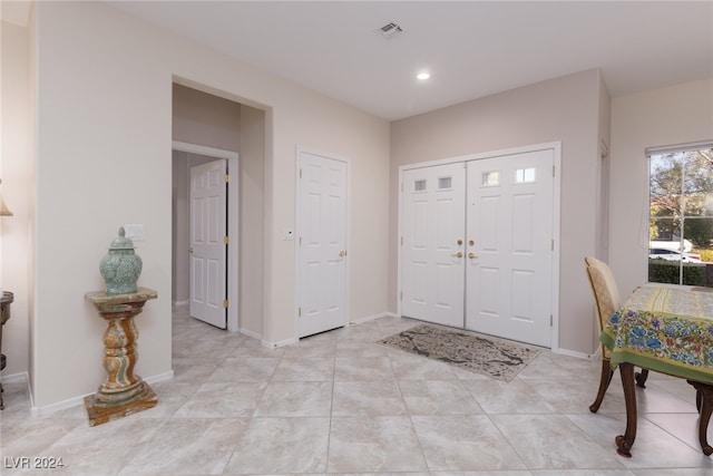 entryway featuring light tile patterned floors