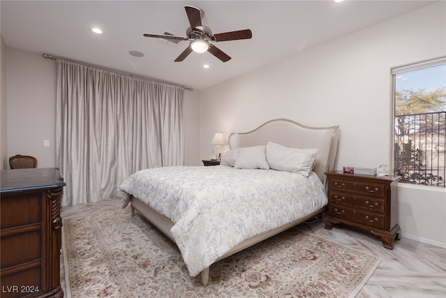 bedroom with ceiling fan and light parquet flooring