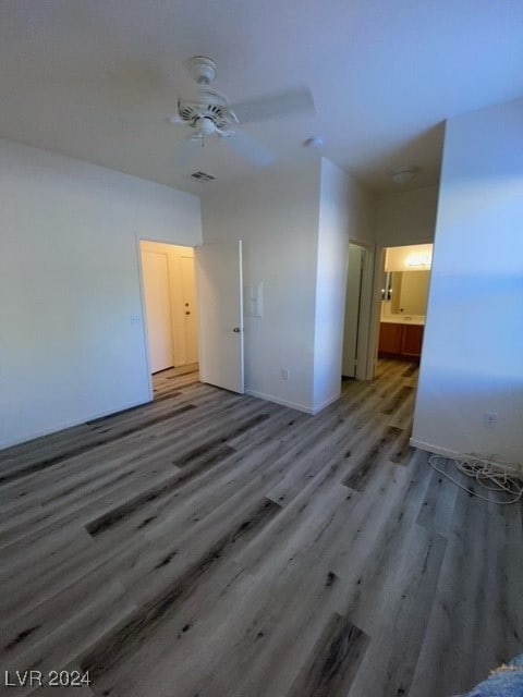 unfurnished bedroom with hardwood / wood-style floors and ceiling fan