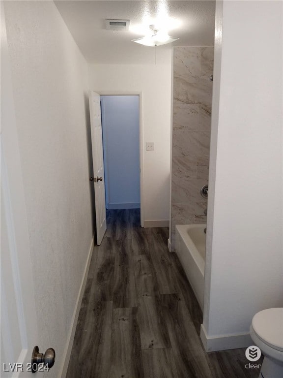 bathroom featuring toilet and hardwood / wood-style floors