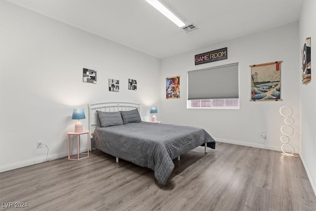 bedroom featuring hardwood / wood-style flooring