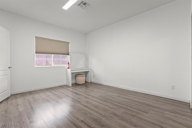 spare room with light hardwood / wood-style flooring