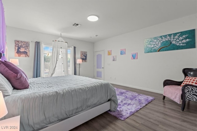 bedroom featuring dark wood-type flooring