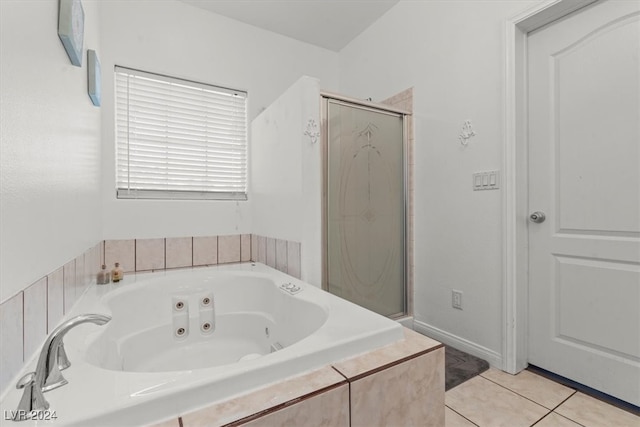 bathroom featuring plus walk in shower and tile patterned flooring