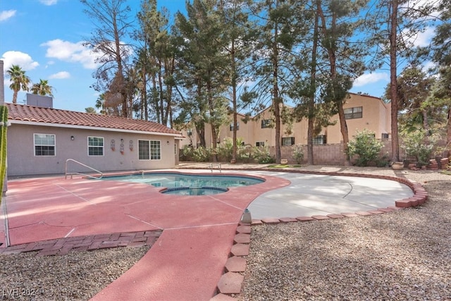 view of swimming pool with a patio area