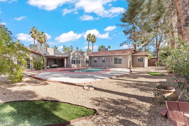 rear view of property featuring a patio area