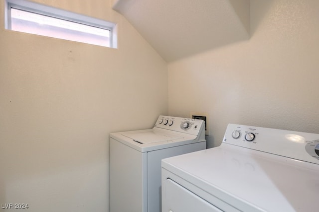 washroom featuring washer and clothes dryer