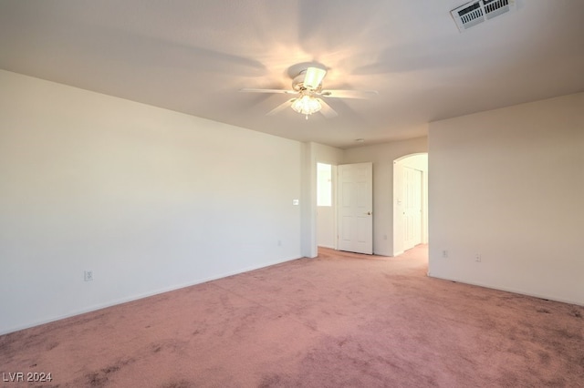 unfurnished room featuring light carpet and ceiling fan