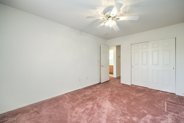 unfurnished bedroom with ceiling fan, a closet, and carpet