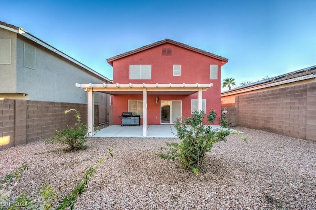 rear view of house featuring a patio