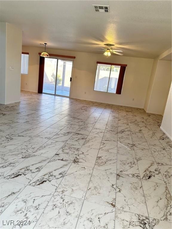 empty room featuring ceiling fan