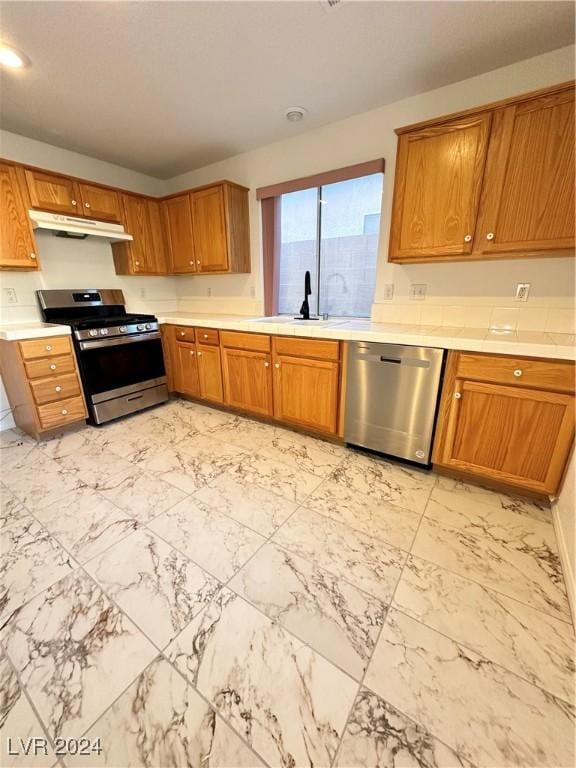 kitchen featuring stainless steel appliances and sink