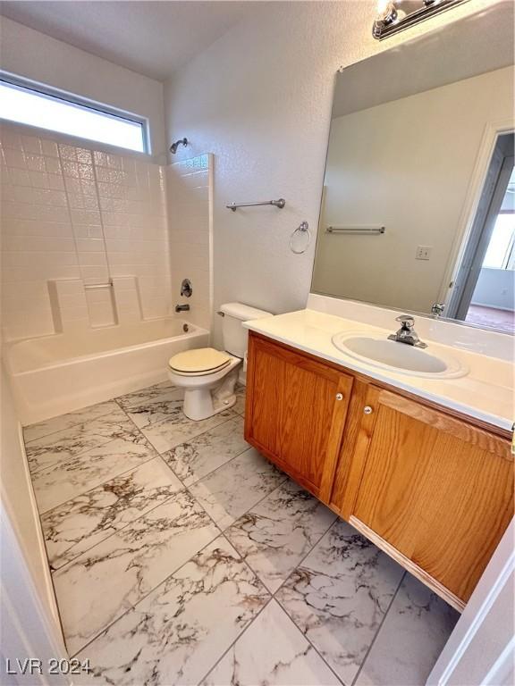 full bathroom with shower / bathing tub combination, vanity, and toilet