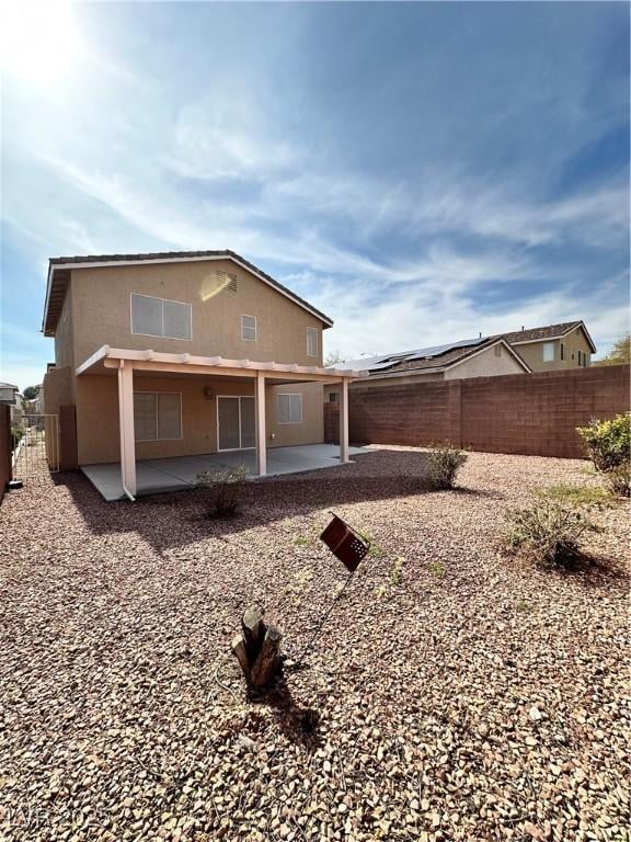 rear view of property with a patio area