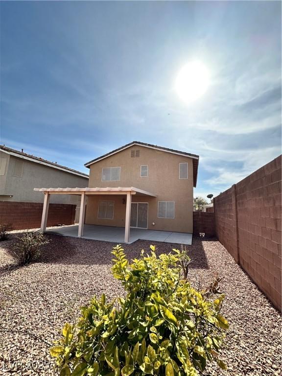 rear view of house with a patio