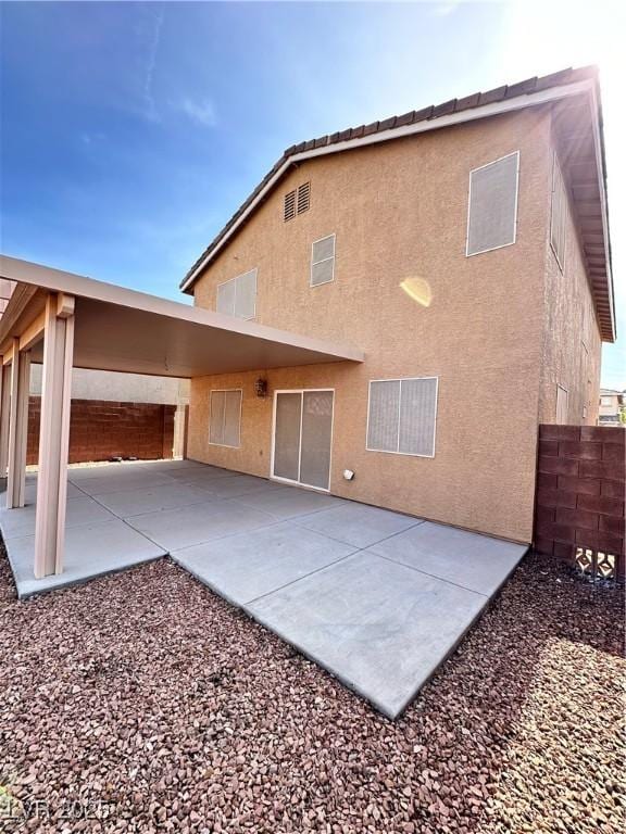 back of house featuring a patio