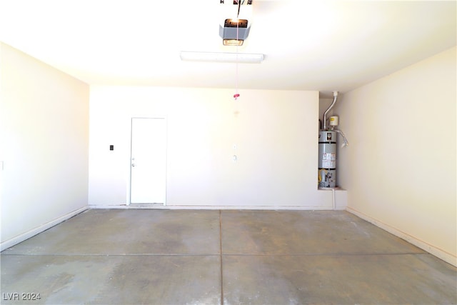 garage with water heater and a garage door opener