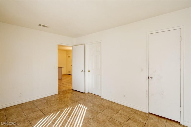 interior space with light tile patterned floors