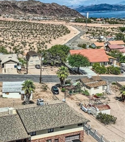 birds eye view of property with a mountain view