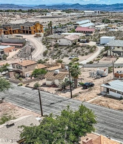 birds eye view of property featuring a mountain view