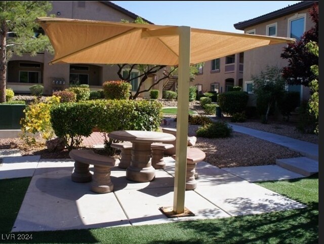 view of property's community featuring a patio